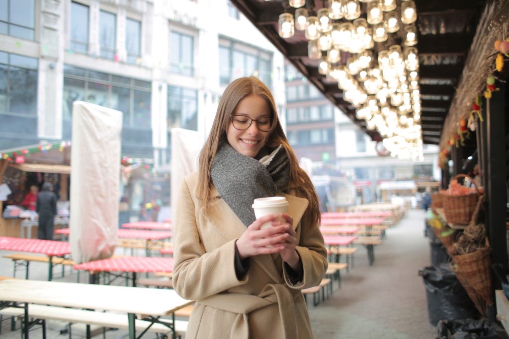 an accountant client that is laughing while holding a cup of coffee