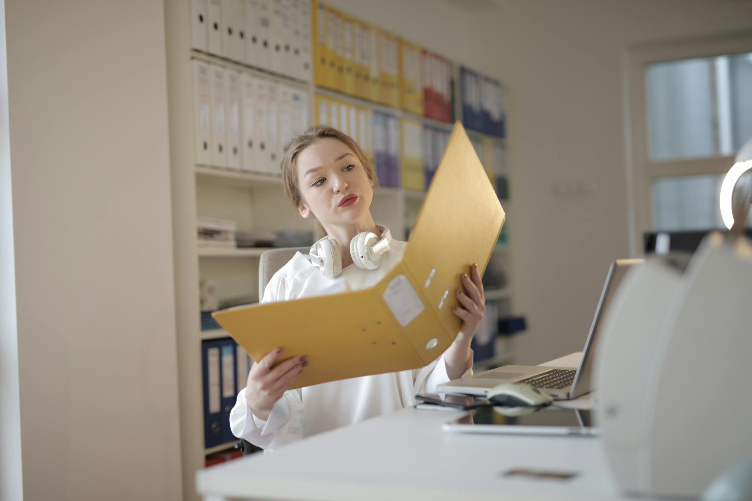 female accountant checking an accounts file