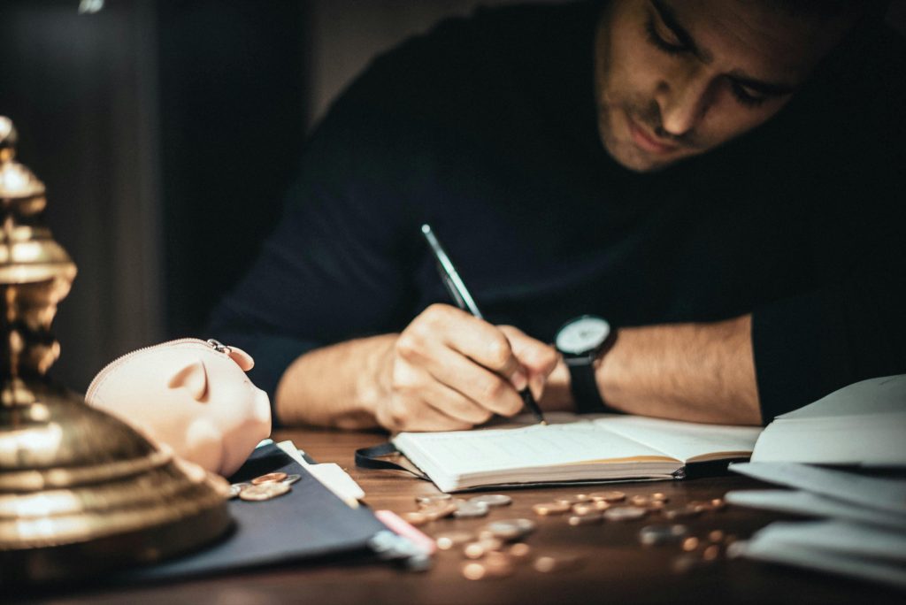 accountant writing on his notebook