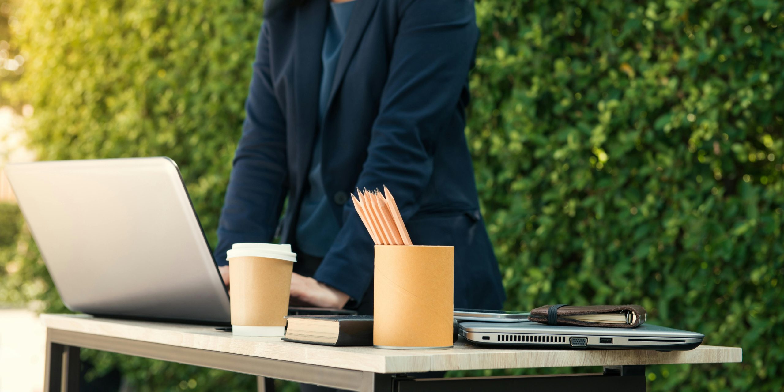 accountant working outside the office with pencils on top of a table