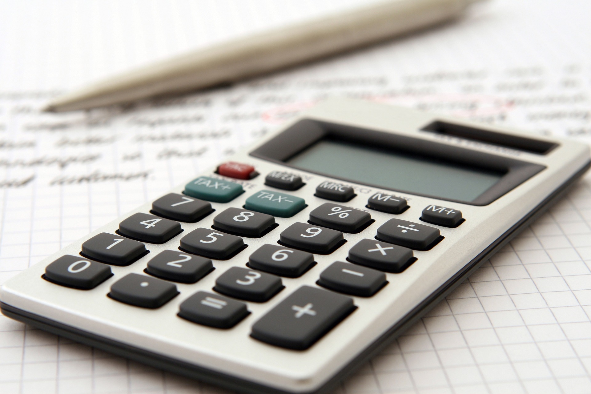 white calculator used for computing tax return