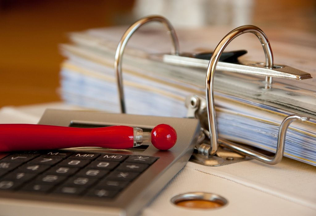 calculator and a file folder