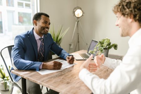 accountant happily speaking with his client