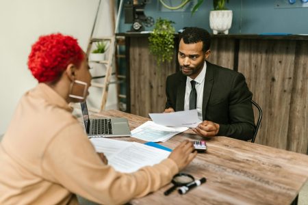 accountant explaining his report to her superior