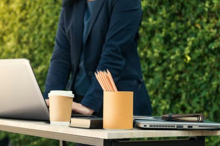 accountant working outside the office with pencils on top of a table